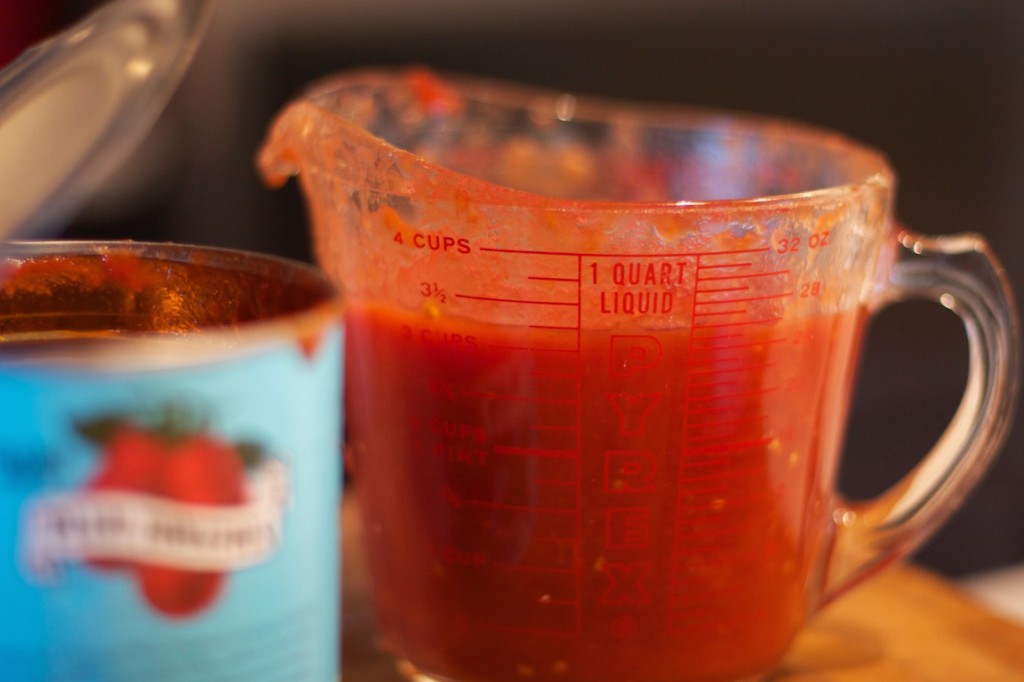 Three cups of whole tomatoes and their juices